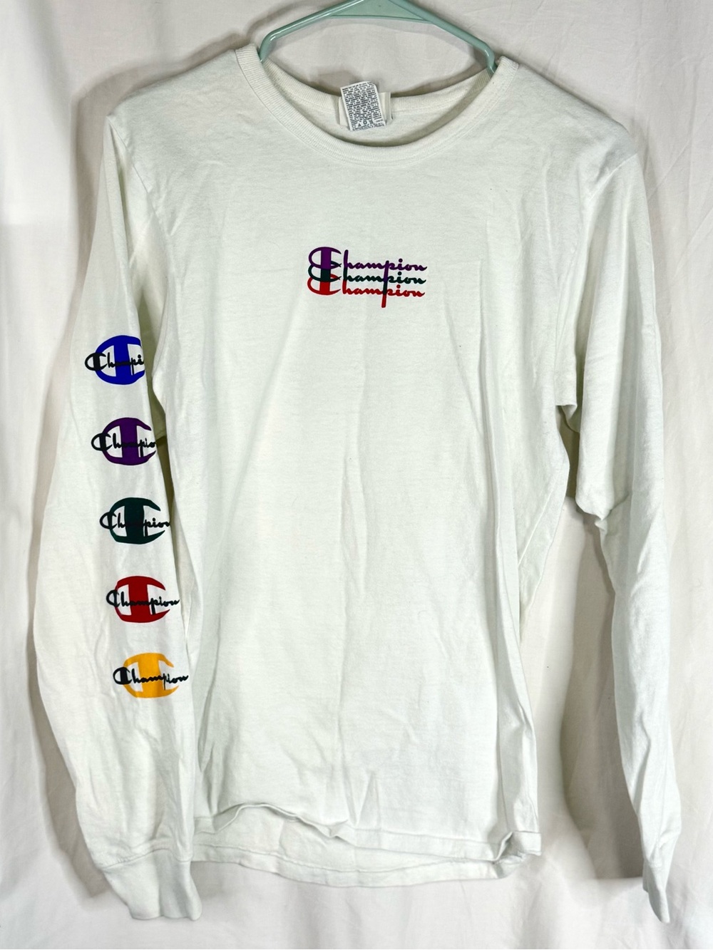 Champion Woman’s White Long Sleeve Tee with Multicolor Logos — Size Small